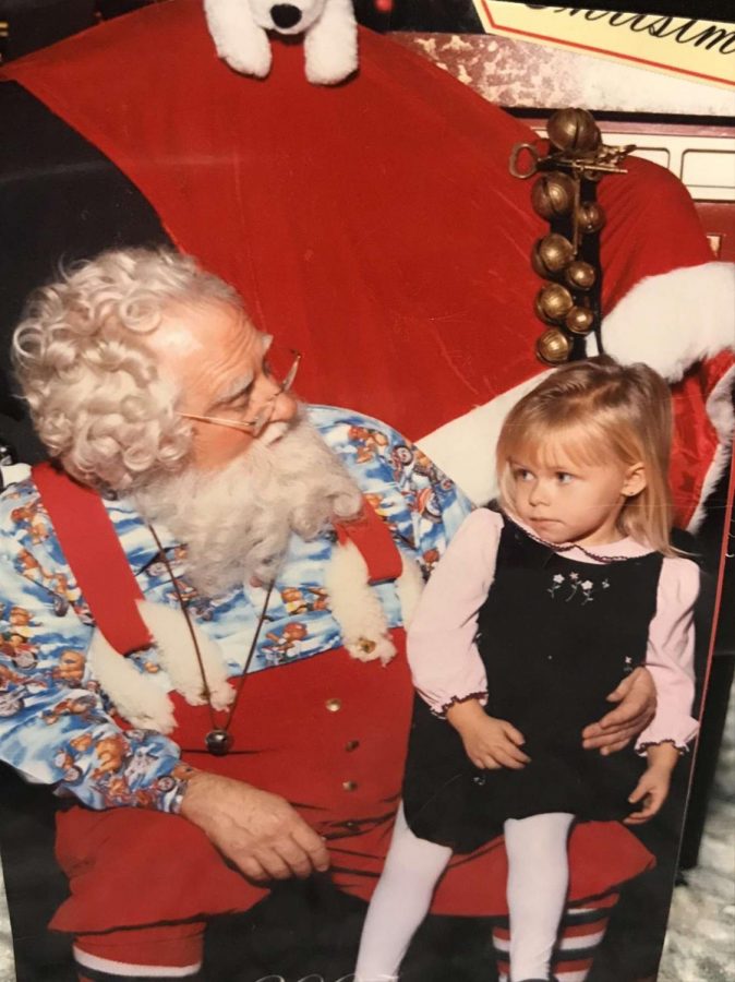 Ava Lyons seems a bit skeptical about Santa at an early age.