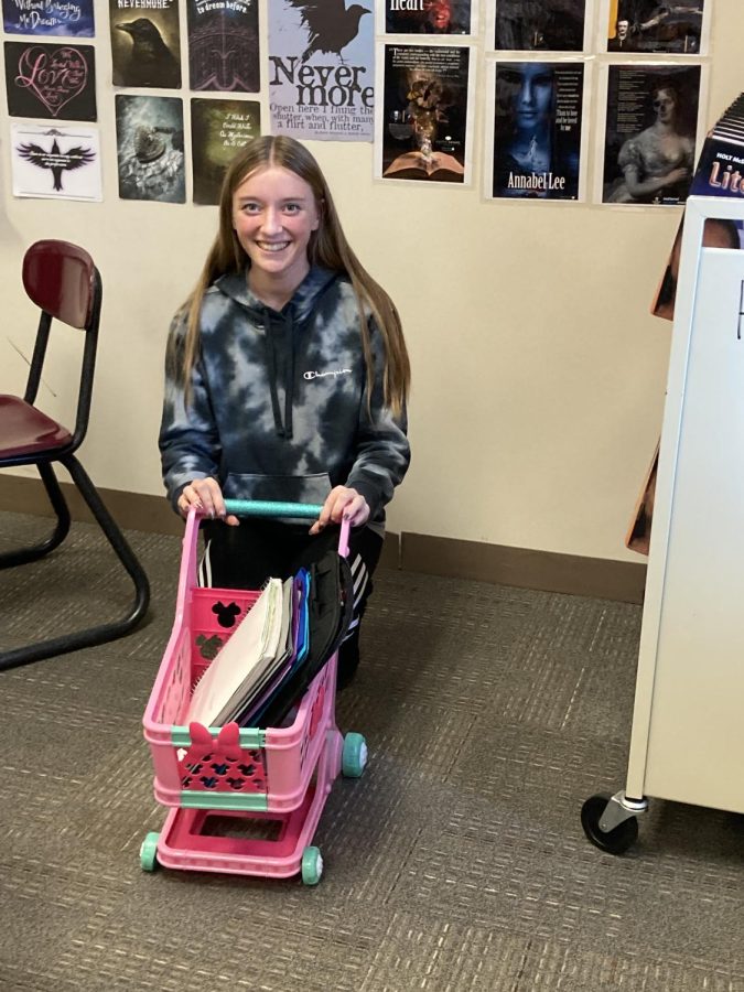 Sophomore Jeri Sackett used a toy shopping cart instead of a backpack.