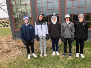 Trojan boys golf not beat down by weather