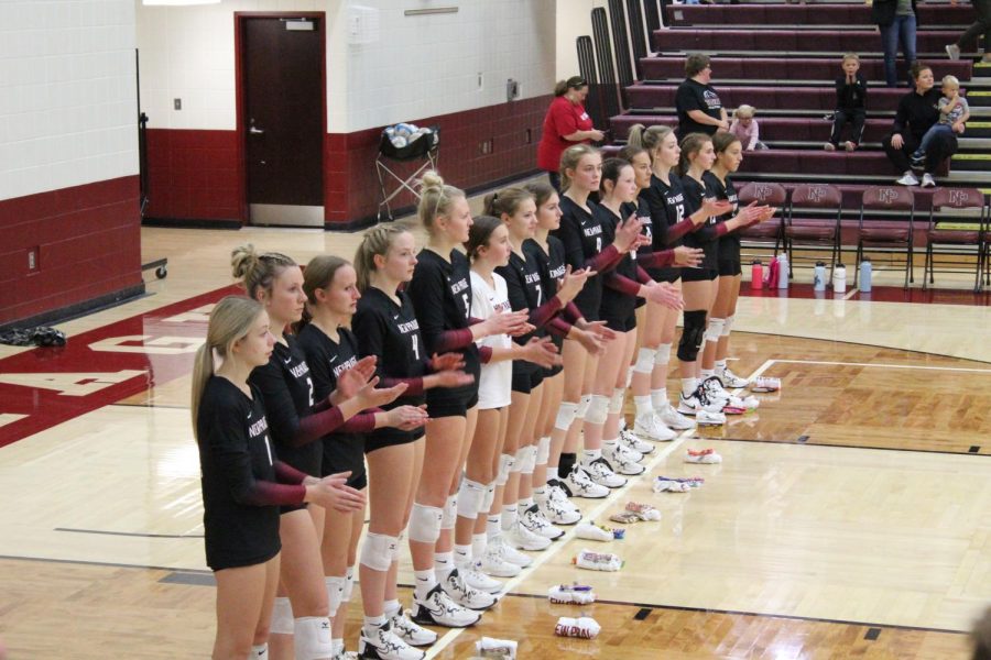 Varsity volleyball lines up to greet the St. Louis Park Orioles Thursday, September 29.