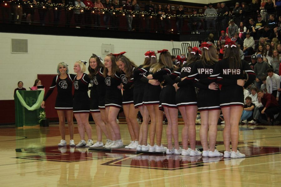 Two of the six international students are part of the cheer team at New Prague High School.