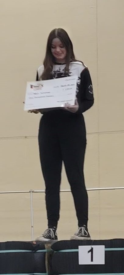 Senior Selah Scherman was recognized as the $1000 scholarship recipient for writing the best essay on the impact that participating in archery has had on her life.